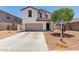Charming two-story home with a two-car garage and well-maintained landscaping at 36025 W Santa Clara Ave, Maricopa, AZ 85138