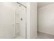 The bathroom showcases a glass enclosed shower stall with shelving at 36025 W Santa Clara Ave, Maricopa, AZ 85138