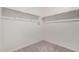 The walk-in closet is a blank canvas featuring bars for hanging clothes at 36025 W Santa Clara Ave, Maricopa, AZ 85138
