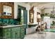 Charming bathroom features a custom green vanity, decorative mirrors, and a view to the pool at 4316 N 40Th St, Phoenix, AZ 85018