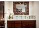 Charming bathroom vanity with decorative mirror and tile accents at 4316 N 40Th St, Phoenix, AZ 85018