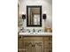 Vintage bathroom with decorative tile, ornate mirror, and sconces flanking the mirror at 4316 N 40Th St, Phoenix, AZ 85018
