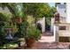 Charming brick courtyard featuring potted plants and outdoor seating near a walkway at 4316 N 40Th St, Phoenix, AZ 85018
