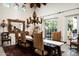 Bright dining room with large table, chandelier, and a view of the outdoor pool at 4316 N 40Th St, Phoenix, AZ 85018