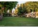 Expansive green front lawn with mature trees enhancing the curb appeal of this home at 4316 N 40Th St, Phoenix, AZ 85018