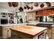 This designer kitchen features a wood island, custom cabinets, and modern appliances at 4316 N 40Th St, Phoenix, AZ 85018