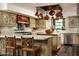 A gourmet kitchen offers custom cabinets, a tile island, and professional grade appliances at 4316 N 40Th St, Phoenix, AZ 85018