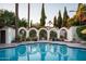 Refreshing pool with decorative architectural archway and surrounding landscape, ideal for leisure at 4316 N 40Th St, Phoenix, AZ 85018