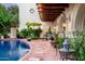 Beautiful pool area with brick patio and lush landscaping at 4316 N 40Th St, Phoenix, AZ 85018
