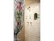 Unique shower featuring decorative tiles and brass hardware at 4316 N 40Th St, Phoenix, AZ 85018
