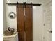 Beautiful custom-built barn doors enhance the design of the house at 500 W Nikita Dr, San Tan Valley, AZ 85140