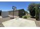 Backyard features a basketball court, a shed, and manicured landscaping for outdoor recreation at 500 W Nikita Dr, San Tan Valley, AZ 85140