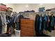 Organized walk-in closet with a dresser, hanging clothes and shelf storage at 500 W Nikita Dr, San Tan Valley, AZ 85140