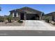Charming single-story home with well-maintained landscaping and a two-car garage at 500 W Nikita Dr, San Tan Valley, AZ 85140