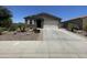 Charming single-story home with well-maintained landscaping and a two-car garage at 500 W Nikita Dr, San Tan Valley, AZ 85140