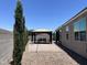 A covered gazebo with dining table and seating in a paved backyard offers outdoor entertaining at 500 W Nikita Dr, San Tan Valley, AZ 85140
