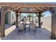 The backyard offers a covered gazebo with dining table and seating for outdoor entertaining at 500 W Nikita Dr, San Tan Valley, AZ 85140
