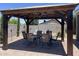 Outdoor dining gazebo with pavers, dining table, and chairs offers an excellent entertaining space at 500 W Nikita Dr, San Tan Valley, AZ 85140