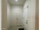 Hallway featuring tile flooring, a front door, and access to rooms at 500 W Nikita Dr, San Tan Valley, AZ 85140