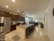 This kitchen is open to the living room with granite counters and stainless steel appliances at 500 W Nikita Dr, San Tan Valley, AZ 85140