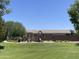 Community playground with slides, swings, and a seating area at 500 W Nikita Dr, San Tan Valley, AZ 85140