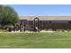 Community playground with slides, swings, benches, and a grassy area at 500 W Nikita Dr, San Tan Valley, AZ 85140