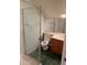 This cozy bathroom boasts a shower, toilet, vanity, and green marble flooring at 6223 N 12Th St # 1, Phoenix, AZ 85014