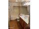 Bathroom featuring a vanity with white sink, commode, and bathtub shower at 6223 N 12Th St # 1, Phoenix, AZ 85014