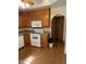 Spacious kitchen features wooden cabinets and modern appliances with laminate flooring at 6223 N 12Th St # 1, Phoenix, AZ 85014
