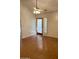 Living room with wood floors, fan, door, and shuttered window at 6223 N 12Th St # 1, Phoenix, AZ 85014