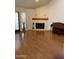 Living room featuring laminate floors and a brick fireplace at 6223 N 12Th St # 1, Phoenix, AZ 85014