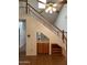 Staircase featuring a wet bar and wooden railing at 6223 N 12Th St # 1, Phoenix, AZ 85014