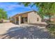 View of the backyard featuring a covered patio and a paved area, perfect for outdoor entertaining at 8354 W Marlette Ave, Glendale, AZ 85305