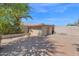 Spacious backyard featuring brick pavers, a detached garage, and secure block wall fencing at 8354 W Marlette Ave, Glendale, AZ 85305