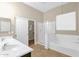 Bathroom featuring double sinks, a shower, and a tub at 8354 W Marlette Ave, Glendale, AZ 85305