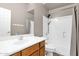 Bathroom featuring a shower, tub, and vanity with a sink at 8354 W Marlette Ave, Glendale, AZ 85305