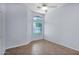 Bright bedroom featuring large windows with neighborhood views and neutral paint at 8354 W Marlette Ave, Glendale, AZ 85305