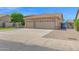Charming single-story home with a tile roof, lush lawn, gated entry, and a two-car garage at 8354 W Marlette Ave, Glendale, AZ 85305
