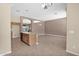 Open concept kitchen and living room with light cabinets and neutral walls at 8354 W Marlette Ave, Glendale, AZ 85305