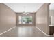 Living room featuring large windows with neighborhood views and neutral paint at 8354 W Marlette Ave, Glendale, AZ 85305
