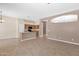 Open-concept living room features neutral color palette and tile flooring at 8354 W Marlette Ave, Glendale, AZ 85305
