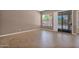 Bright living room with tile flooring, large windows, and sliding glass door for natural light at 8354 W Marlette Ave, Glendale, AZ 85305