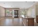 Open floorplan featuring tile floors, large windows, and a kitchen with island at 8354 W Marlette Ave, Glendale, AZ 85305