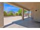 Covered patio featuring architectural columns providing a shaded outdoor living space and backyard views at 8354 W Marlette Ave, Glendale, AZ 85305