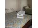 Cozy bedroom with traditional furnishings, floral bedding, and mirrored closet doors at 9728 N 106Th Pl # 154, Scottsdale, AZ 85258