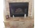 Tiled fireplace with decorative accents on mantel at 9728 N 106Th Pl # 154, Scottsdale, AZ 85258