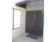 The entryway features a wrought iron security door and a matching window accent at 9728 N 106Th Pl # 154, Scottsdale, AZ 85258