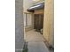 Inviting front entrance with decorative security door and shuttered window at 9728 N 106Th Pl # 154, Scottsdale, AZ 85258