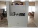 Open living area with built-in shelving and view into dining space at 9728 N 106Th Pl # 154, Scottsdale, AZ 85258