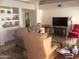 Comfortable living room with plush seating and built-in shelving at 9728 N 106Th Pl # 154, Scottsdale, AZ 85258